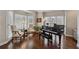 Inviting living room with a baby grand piano and bay windows at 1438 Livingston Sw Dr, Marietta, GA 30064