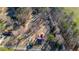Aerial view of home, adjacent outbuildings and treed lot at 436 Tarpley Ave, Bowdon, GA 30108