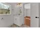 Well-lit bathroom featuring a modern sink, mirror, and fixtures at 436 Tarpley Ave, Bowdon, GA 30108