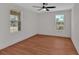 Bedroom featuring laminate floors, neutral paint and dual windows with natural light at 436 Tarpley Ave, Bowdon, GA 30108