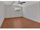 Spacious bedroom with neutral walls, a ceiling fan and laminate flooring at 436 Tarpley Ave, Bowdon, GA 30108