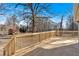 A wooden deck overlooks a large yard with mature trees at 436 Tarpley Ave, Bowdon, GA 30108