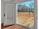 Exterior deck with wood railing and flooring at 436 Tarpley Ave, Bowdon, GA 30108