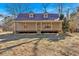 Inviting home with a cozy front porch and a classic metal roof design at 436 Tarpley Ave, Bowdon, GA 30108