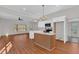 Bright open-concept kitchen features white cabinets, island, and modern finishes at 436 Tarpley Ave, Bowdon, GA 30108