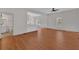 Spacious living room with wood-look floors, ceiling fan and natural light at 436 Tarpley Ave, Bowdon, GA 30108