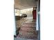 Back porch features exposed brick steps, and outdoor seating area at 823 Mount Tabor Rd, Oxford, GA 30054
