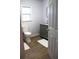 Cozy bathroom with wood-look floors, modern vanity, and bright natural light at 823 Mount Tabor Rd, Oxford, GA 30054
