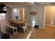 Charming dining room featuring a rustic table, a brick fireplace, and modern farmhouse decor at 823 Mount Tabor Rd, Oxford, GA 30054