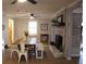 Bright dining room featuring a brick fireplace, a rustic table, and hardwood floors at 823 Mount Tabor Rd, Oxford, GA 30054