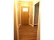 Inviting foyer featuring warm wood-look floors and a stylish front door at 823 Mount Tabor Rd, Oxford, GA 30054