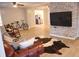 Living room featuring a rustic bicycle, comfortable leather furniture, and open access to the kitchen at 823 Mount Tabor Rd, Oxford, GA 30054