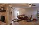 Inviting living room featuring a decorative fireplace, comfortable seating, and wood floors at 823 Mount Tabor Rd, Oxford, GA 30054