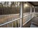 View from the porch of a rural landscape with abundant trees and a quiet road at 823 Mount Tabor Rd, Oxford, GA 30054
