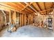 Unfinished basement with wooden framing and exposed ceiling, offering potential for customization and additional living space at 920 Pine Grove Pointe Dr, Roswell, GA 30075