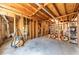 Unfinished basement featuring exposed beams and framing, providing ample storage and potential for customization at 920 Pine Grove Pointe Dr, Roswell, GA 30075