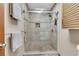 Bathroom featuring a spacious shower with a frameless glass enclosure and tiled walls at 920 Pine Grove Pointe Dr, Roswell, GA 30075