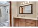 Bathroom view showcasing a shower, vanity, and cabinet storage at 920 Pine Grove Pointe Dr, Roswell, GA 30075