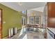 Bright dining area with an open floor plan and a sliding glass door to the outdoor deck at 920 Pine Grove Pointe Dr, Roswell, GA 30075