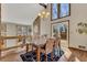 Well-lit dining area featuring an outdoor deck, open floor plan, and modern decor at 920 Pine Grove Pointe Dr, Roswell, GA 30075