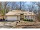 Charming single-story home with a two-car garage and well-manicured landscaping at 920 Pine Grove Pointe Dr, Roswell, GA 30075
