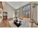 Spacious living room features hardwood floors, a fireplace, and a walkout deck at 920 Pine Grove Pointe Dr, Roswell, GA 30075