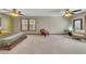 Generous bedroom with carpet, ceiling fan, and large windows showing the outdoors at 920 Pine Grove Pointe Dr, Roswell, GA 30075