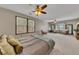 Spacious main bedroom featuring dual ceiling fans, lots of natural light, and cozy decor at 920 Pine Grove Pointe Dr, Roswell, GA 30075