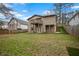 Spacious backyard with a view of the house featuring a deck and stairs on a slight incline at 1684 Braeburn Se Dr, Atlanta, GA 30316
