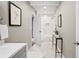 Bathroom featuring marble tile floors, a toilet, vanity, and walk-in shower at 1684 Braeburn Se Dr, Atlanta, GA 30316