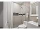 This bathroom features tiled walls, tiled floors and a shower with a shower curtain at 1684 Braeburn Se Dr, Atlanta, GA 30316