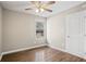Bedroom with hardwood floors, a ceiling fan, and a large window at 1684 Braeburn Se Dr, Atlanta, GA 30316