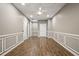 This bonus room features hard wood floors and decorative trim on the walls at 1684 Braeburn Se Dr, Atlanta, GA 30316