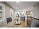 Open dining room shows wood floors, kitchen, and living spaces at 1684 Braeburn Se Dr, Atlanta, GA 30316