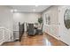 Dining room with wood floors, recessed lighting, and wainscoting detail near front door at 1684 Braeburn Se Dr, Atlanta, GA 30316