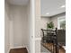 Bright entryway with hardwood floors leads to a dining area with seating and modern railings at 1684 Braeburn Se Dr, Atlanta, GA 30316