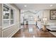 Hardwood floors extending into a white kitchen with stainless steel appliances at 1684 Braeburn Se Dr, Atlanta, GA 30316
