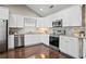 Modern kitchen with white cabinets, stainless steel appliances, and granite countertops at 1684 Braeburn Se Dr, Atlanta, GA 30316