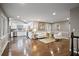 Open-concept living space with hardwood floors, white kitchen, and natural light at 1684 Braeburn Se Dr, Atlanta, GA 30316