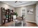 A furnished office with built in shelves, a desk and hard wood floors at 1684 Braeburn Se Dr, Atlanta, GA 30316