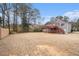 Large grassy backyard, ideal for outdoor activities and entertaining, with wooden deck at 2901 Soapstone Ct, Powder Springs, GA 30127