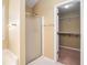 Bathroom featuring a walk-in shower and a spacious walk-in closet at 2901 Soapstone Ct, Powder Springs, GA 30127