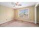 Bright bedroom with neutral walls, ceiling fan, and window dressed with horizontal blinds at 2901 Soapstone Ct, Powder Springs, GA 30127