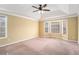 Bright and spacious bedroom with large windows, a trey ceiling, and neutral carpeting at 2901 Soapstone Ct, Powder Springs, GA 30127