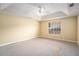 Spacious bedroom with a tray ceiling and carpet flooring at 2901 Soapstone Ct, Powder Springs, GA 30127