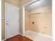Practical laundry room with washer hookups, wire shelving, and neutral-colored walls at 2901 Soapstone Ct, Powder Springs, GA 30127
