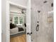 Stylish bathroom with a glass-enclosed shower, visible from the primary bedroom at 1208 Thomas Rd, Decatur, GA 30030