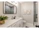 Modern bathroom with a white vanity, dual mirror and a glass-enclosed shower at 1208 Thomas Rd, Decatur, GA 30030