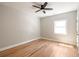 Bedroom boasting light-filled space, neutral walls, ceiling fan and hardwood floors at 1208 Thomas Rd, Decatur, GA 30030