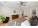 Calm primary bedroom with hardwood floors and a ceiling fan, bathed in natural light at 1208 Thomas Rd, Decatur, GA 30030